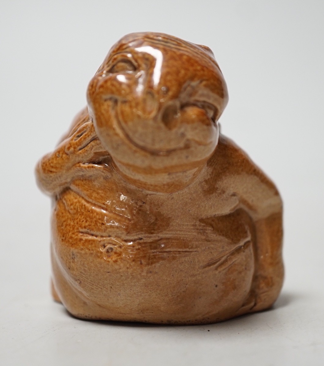 An unusual Royal Doulton salt-glazed stoneware grotesque figure. 6cm tall
